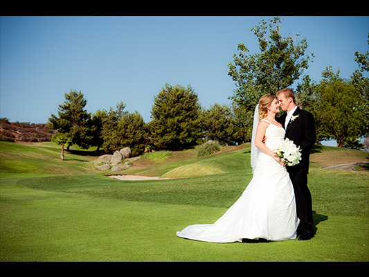 bride and groom on course