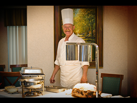 smiling chef at carving station